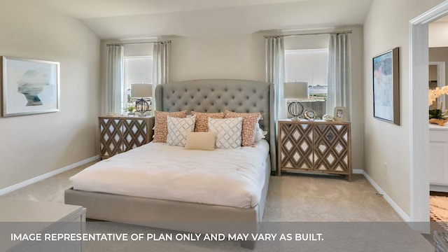 bedroom featuring lofted ceiling and light colored carpet