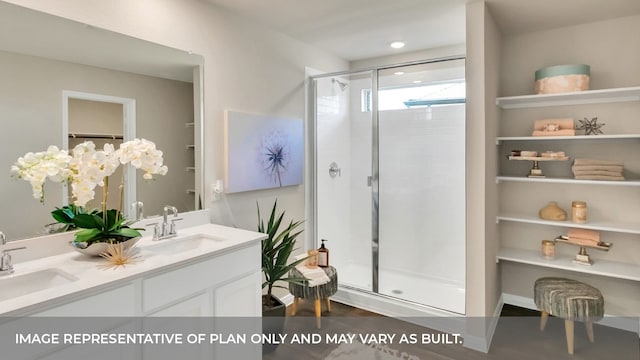 bathroom featuring vanity, hardwood / wood-style flooring, and an enclosed shower