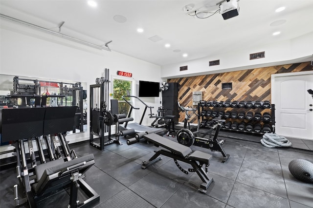 workout area with wooden walls