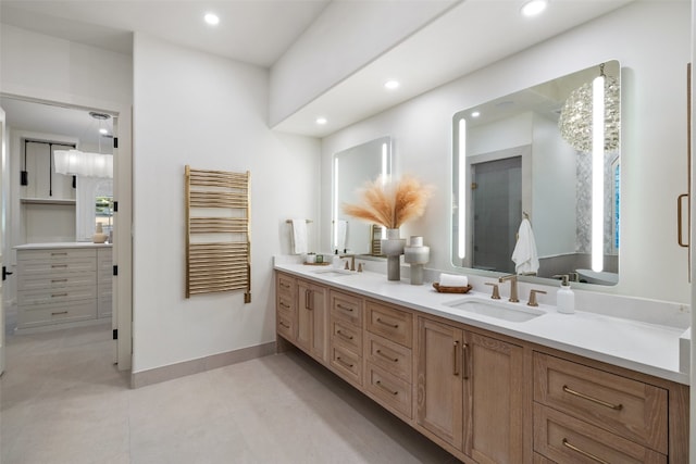 bathroom featuring vanity and radiator