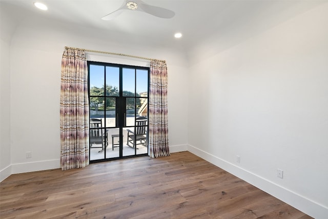 empty room featuring ceiling fan and hardwood / wood-style flooring