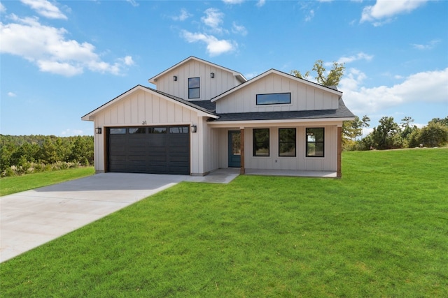 modern inspired farmhouse featuring a front yard and a garage