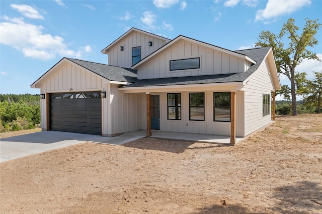 modern farmhouse featuring a garage