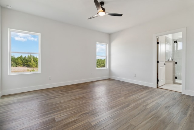 empty room featuring hardwood / wood-style floors and ceiling fan