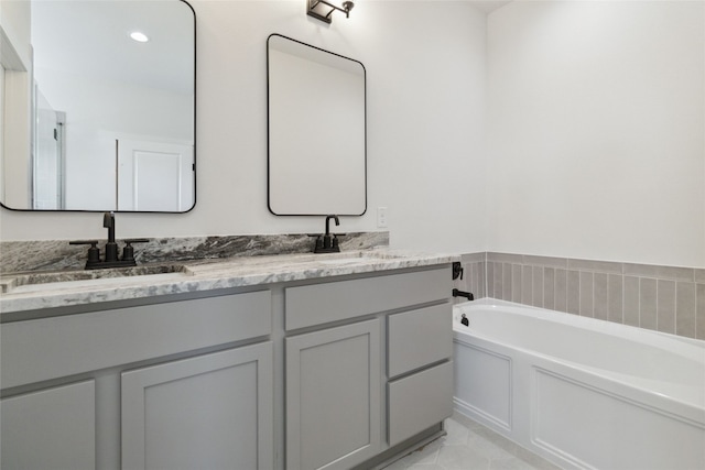 bathroom with a bathtub and vanity