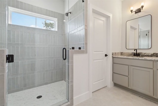 bathroom with vanity and a shower with shower door