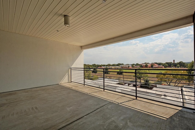 view of patio featuring a balcony