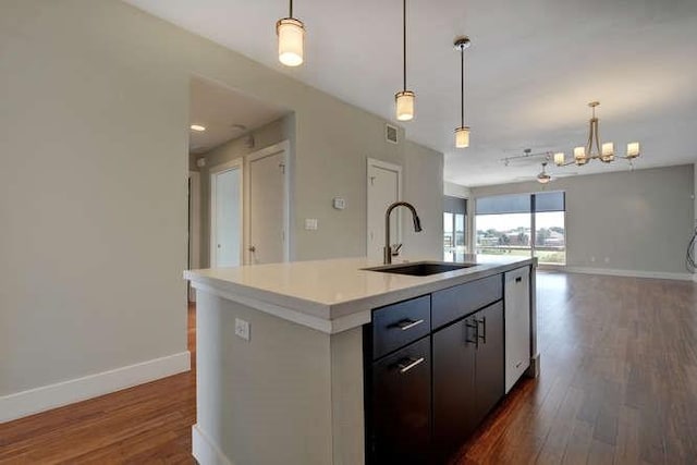 2612 W 12th St Unit 401, Austin, TX 78703 - kitchen with a sink, baseboards, dark wood-type flooring, and open floor plan