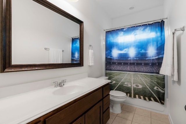 bathroom featuring vanity, toilet, and tile patterned flooring