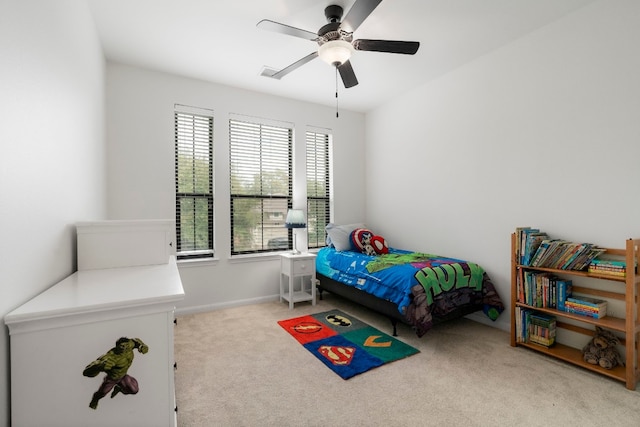 bedroom with light carpet and ceiling fan