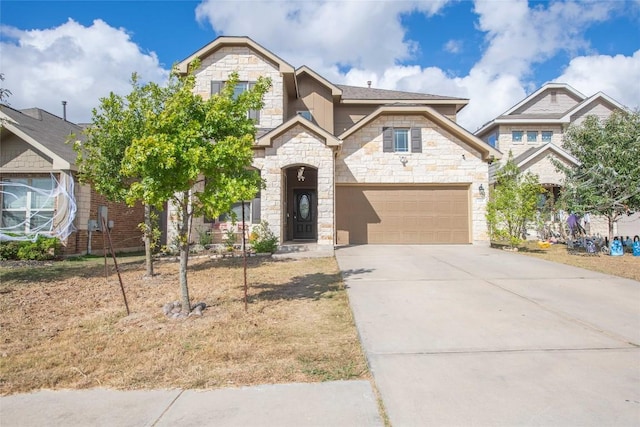 225 Shale Cir, Buda, TX 78610 - view of front of property featuring stone siding, concrete driveway, and an attached garage