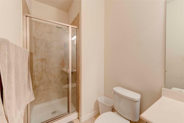 225 Shale Cir, Buda, TX 78610 - bathroom featuring toilet, a stall shower, and vanity