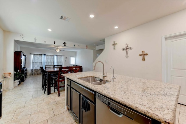 225 Shale Cir, Buda, TX 78610 - kitchen with a sink, dishwasher, an island with sink, light stone countertops, and recessed lighting