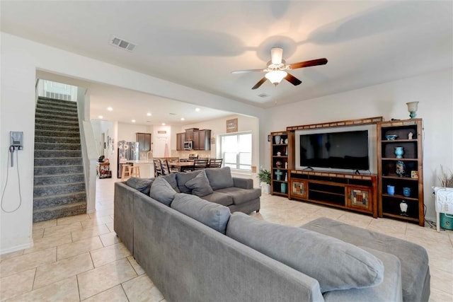 225 Shale Cir, Buda, TX 78610 - living room featuring stairs, light tile patterned floors, ceiling fan, baseboards, and recessed lighting