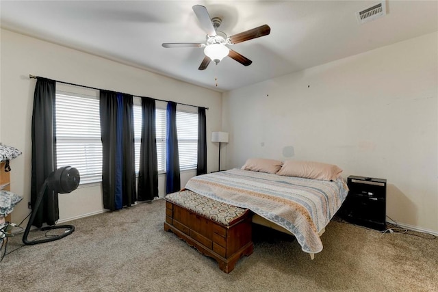 225 Shale Cir, Buda, TX 78610 - bedroom with light carpet, baseboards, and ceiling fan