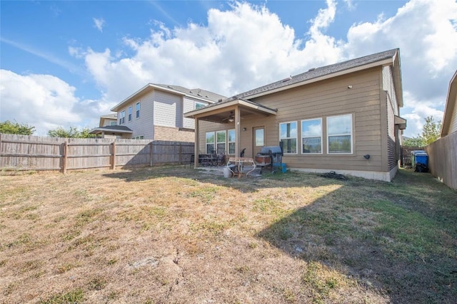 225 Shale Cir, Buda, TX 78610 - back of property with a patio area