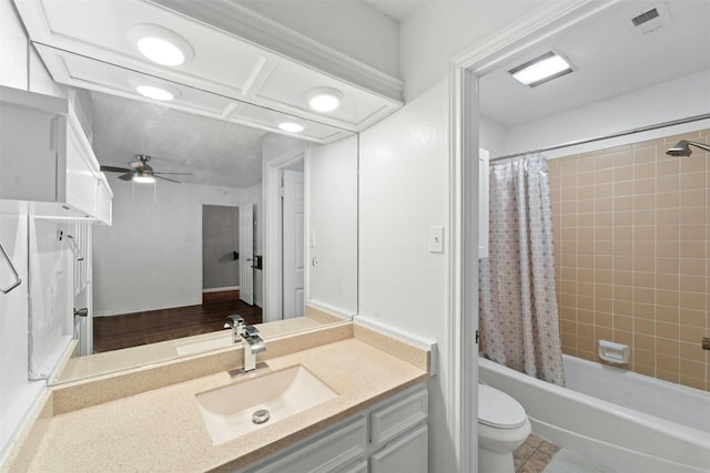 full bathroom featuring toilet, ceiling fan, shower / bath combo with shower curtain, vanity, and hardwood / wood-style flooring