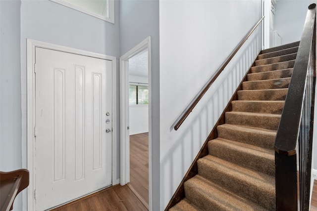 entrance foyer with hardwood / wood-style floors