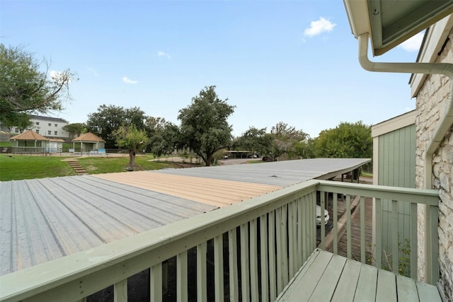 deck featuring a lawn