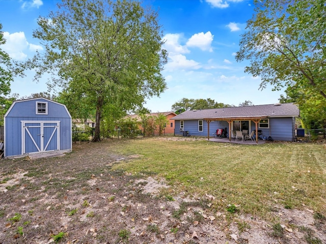 view of yard with a patio and a storage shed