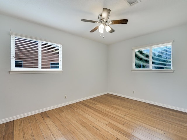 empty room with light hardwood / wood-style floors and ceiling fan