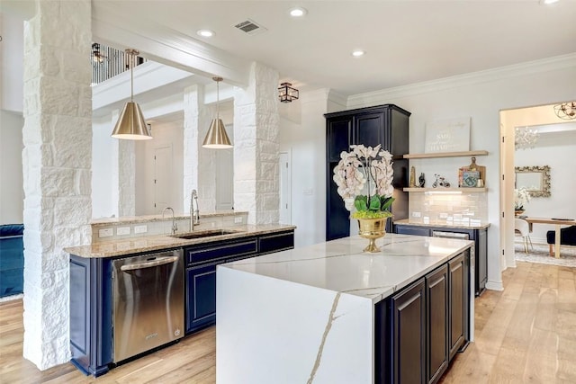 15006 Nightingale Ln, Austin, TX 78734 - kitchen with stainless steel dishwasher, backsplash, light wood finished floors, crown molding, and open shelves
