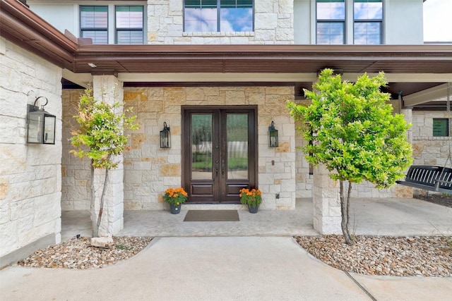 15006 Nightingale Ln, Austin, TX 78734 - view of exterior entry with stone siding and french doors