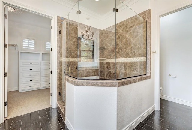 15006 Nightingale Ln, Austin, TX 78734 - bathroom with a shower stall, wood finish floors, crown molding, and a chandelier