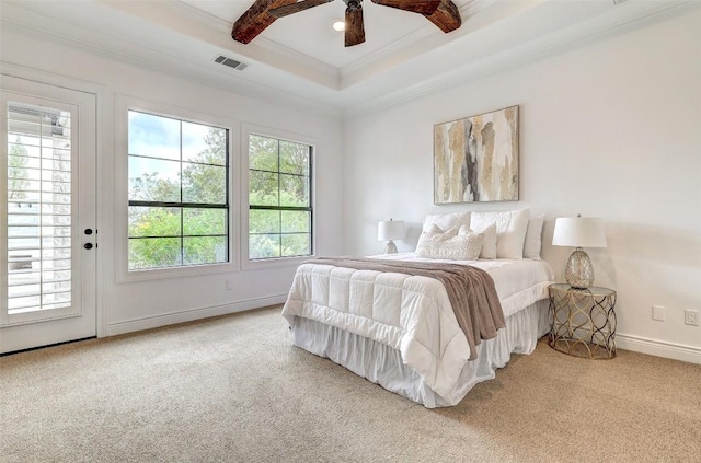 bedroom featuring multiple windows, beam ceiling, carpet floors, and ornamental molding