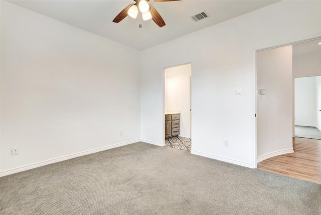 15006 Nightingale Ln, Austin, TX 78734 - unfurnished bedroom with light carpet, connected bathroom, and ceiling fan