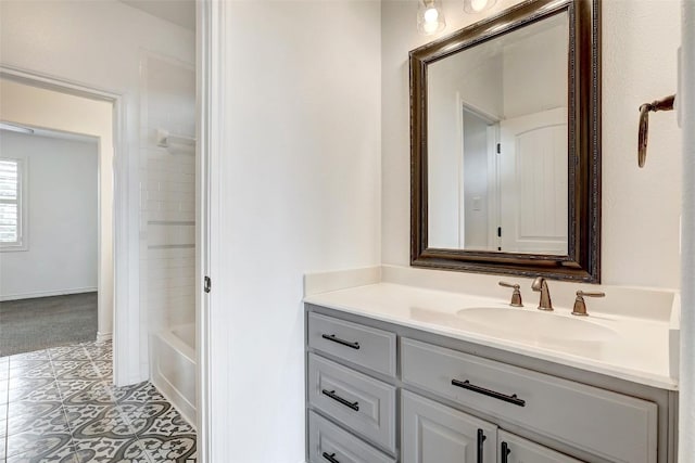 bathroom with vanity, tiled shower / bath combo, and tile patterned floors