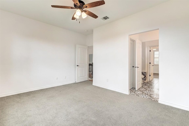 unfurnished bedroom with light carpet and ceiling fan