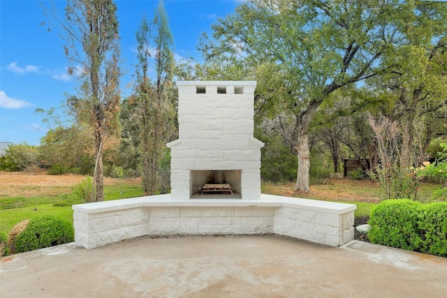 view of patio / terrace with an outdoor stone fireplace