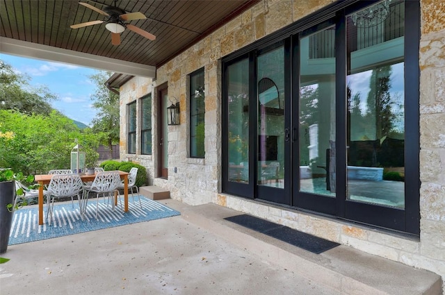 view of patio with french doors and ceiling fan