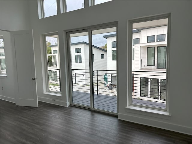 doorway to outside with dark wood-type flooring