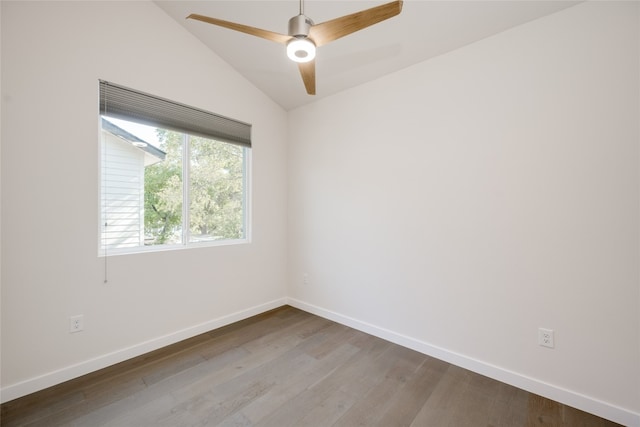 empty room with lofted ceiling, hardwood / wood-style floors, and ceiling fan