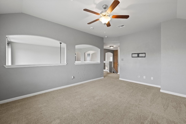 unfurnished room with ceiling fan, carpet, and lofted ceiling