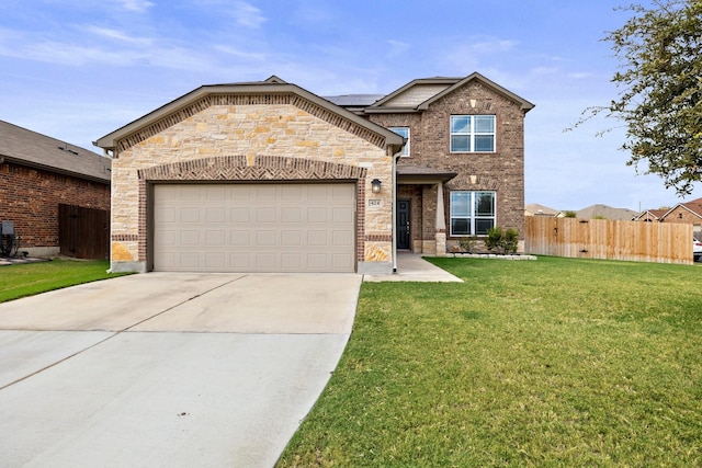 view of front of property with a garage and a front yard