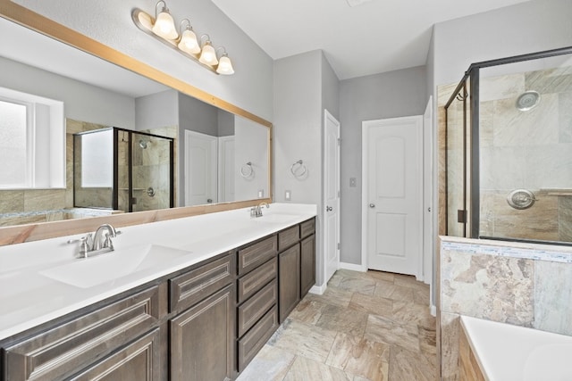 bathroom with vanity and independent shower and bath