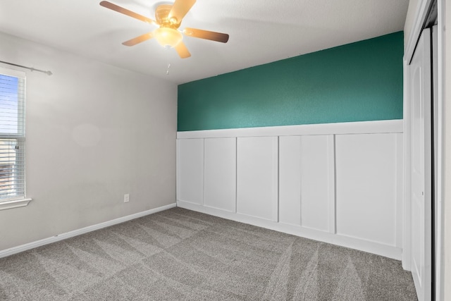 unfurnished bedroom with ceiling fan, light colored carpet, and a closet