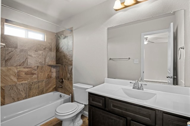424 Hendelson Ln, Hutto, TX 78634 - bathroom featuring toilet, vanity, shower / washtub combination, and ceiling fan