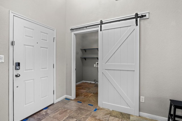424 Hendelson Ln, Hutto, TX 78634 - foyer with a barn door and baseboards