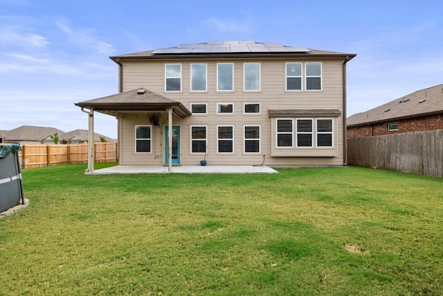 424 Hendelson Ln, Hutto, TX 78634 - back of property with a patio and roof mounted solar panels
