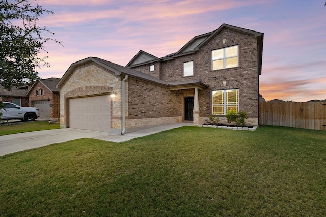 424 Hendelson Ln, Hutto, TX 78634 - traditional-style home with a garage, driveway, and brick siding