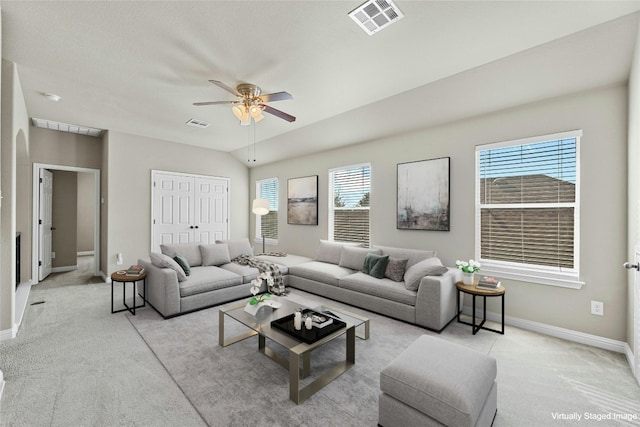 living room featuring light colored carpet and ceiling fan