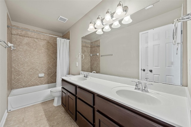 full bathroom with vanity, shower / tub combo with curtain, toilet, and tile patterned flooring