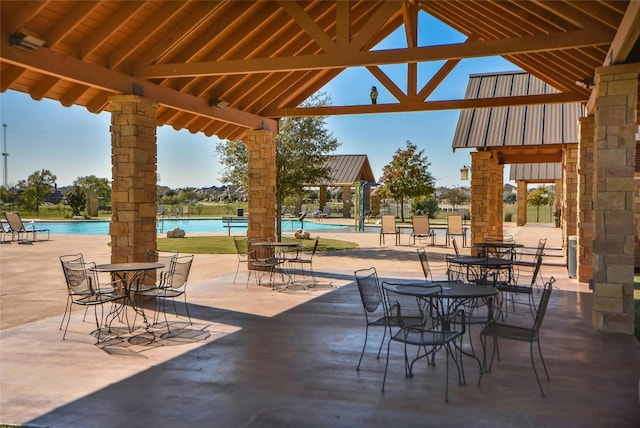 view of patio featuring a community pool