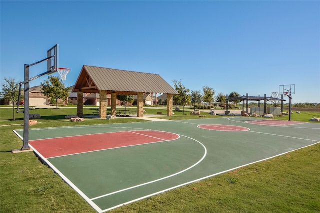 view of basketball court with a gazebo and a yard