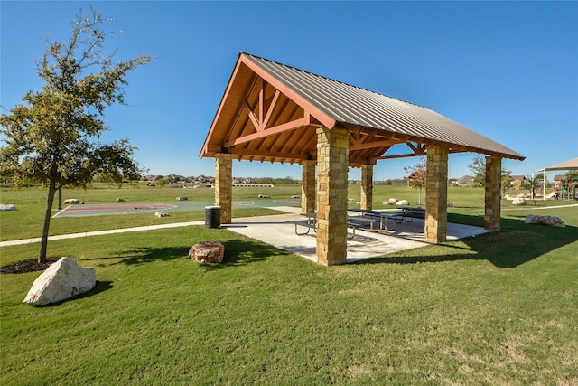 view of property's community featuring a gazebo and a lawn