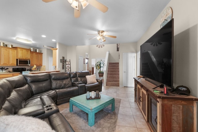 tiled living room with ceiling fan